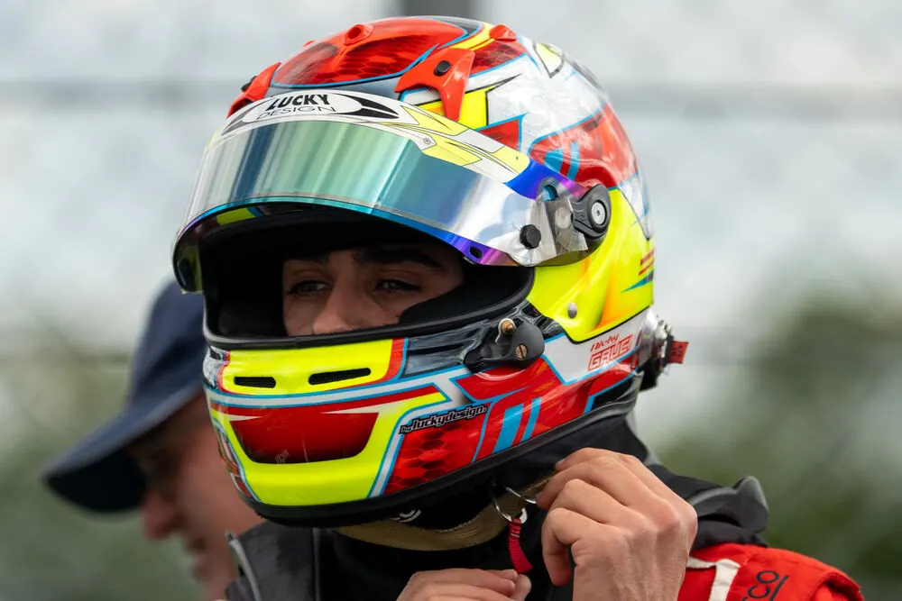 Driver fitting his helmet