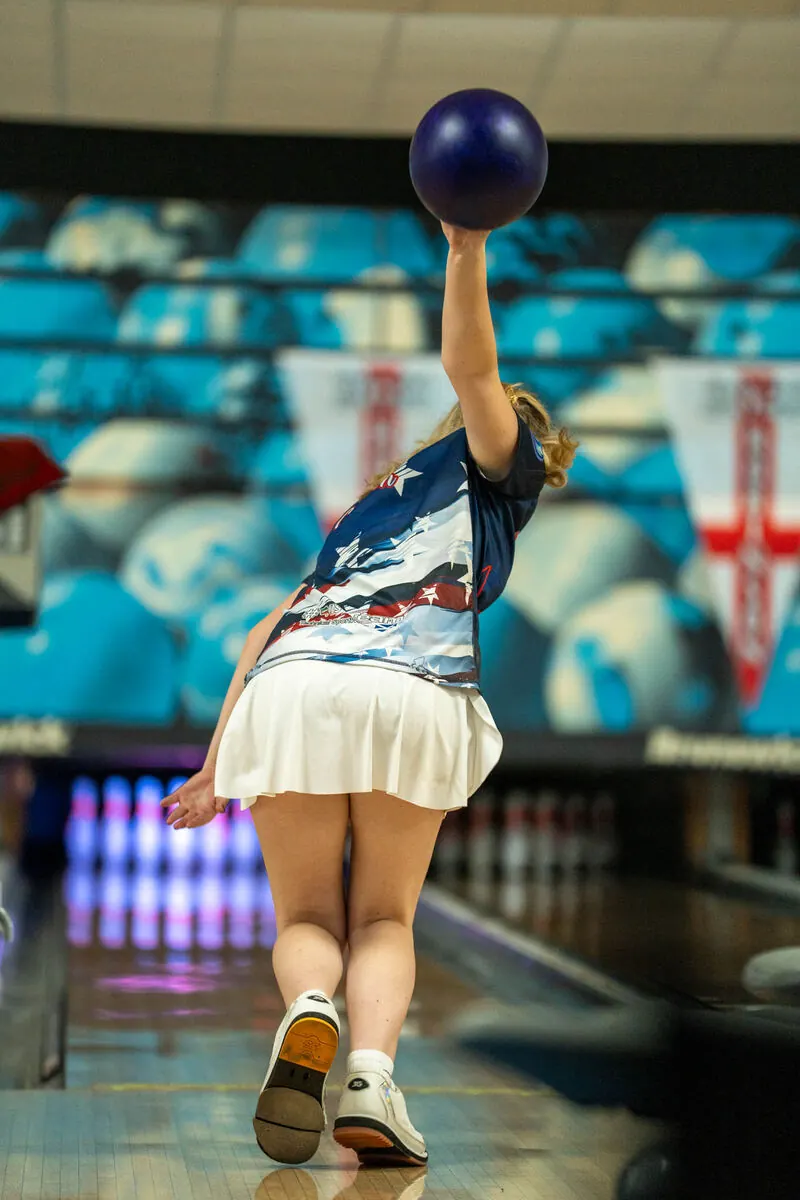 Bowler mid-delivery
