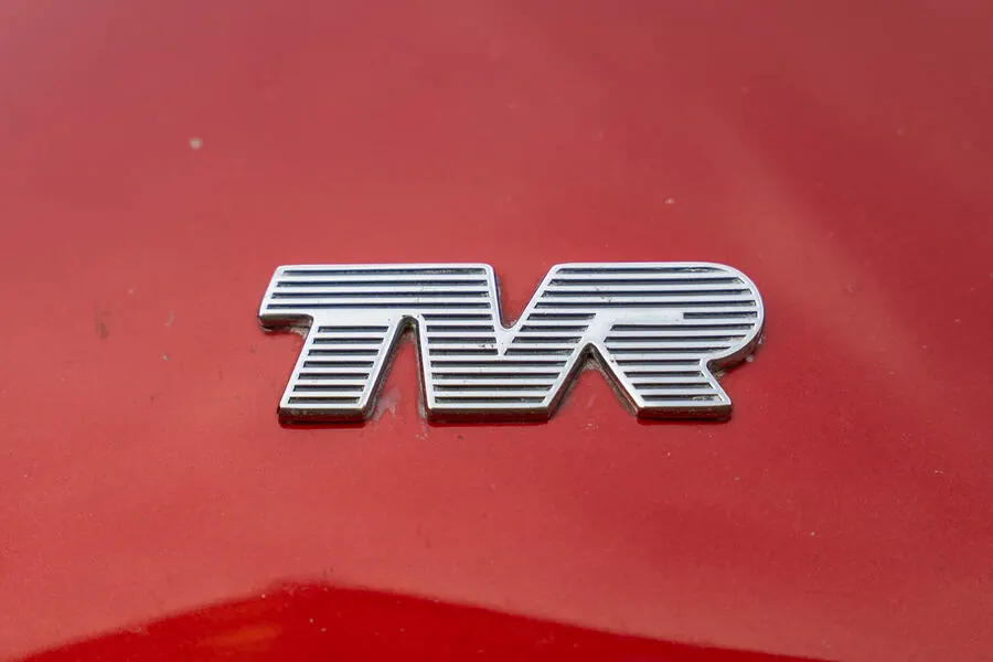 TVR badge on red paint