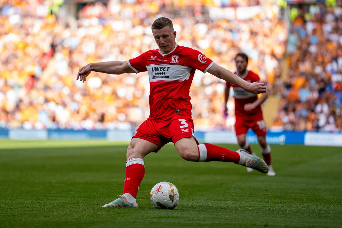 Footballer striking the ball at Wembley